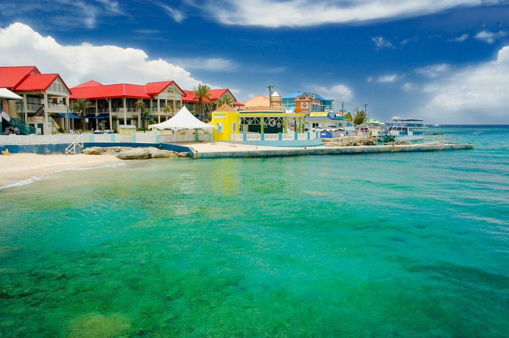 Luxury hotels in Grand Cayman overlooking the sea.